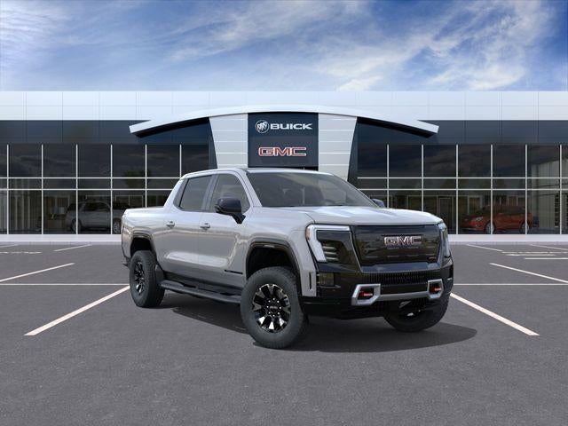 2026 GMC Sierra EV AT4 Max Range in Thunderstorm Gray — front three-quarter view