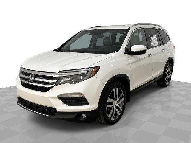 2016 Honda Pilot Touring in White — front three-quarter view
